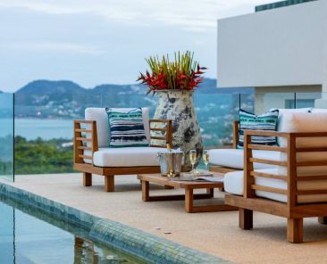 Bespoke luxury outdoor furniture on a Koh Samui villa terrace overlooking the pool