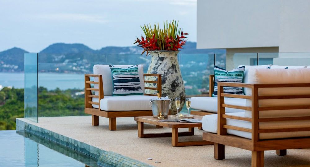 Bespoke luxury outdoor furniture on a Koh Samui villa terrace overlooking the pool