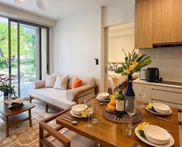 Refined compact living room with bespoke low-profile furniture and natural light