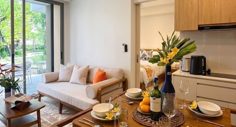 Refined compact living room with bespoke low-profile furniture and natural light