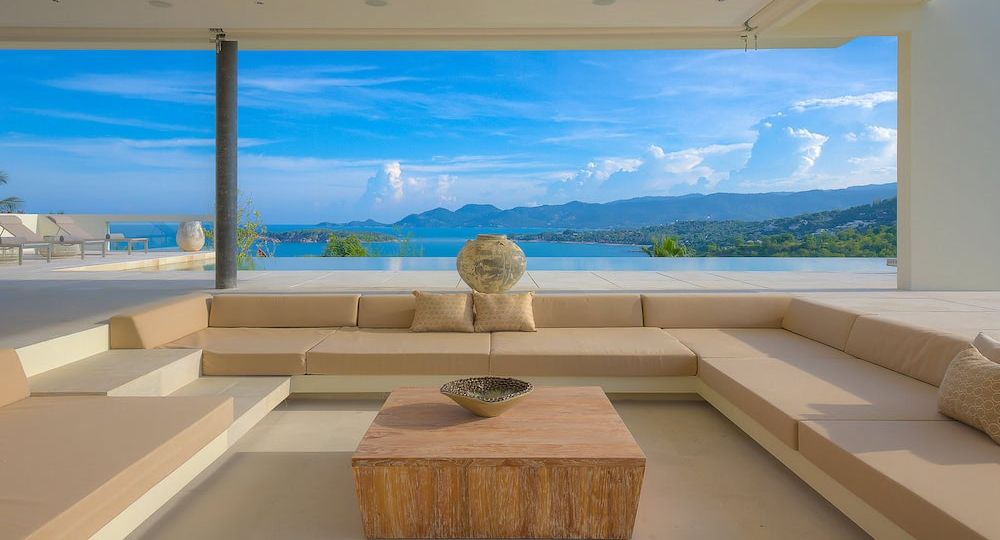 Modern beach house interior design in a Phuket villa with warm minimalist coastal styling.