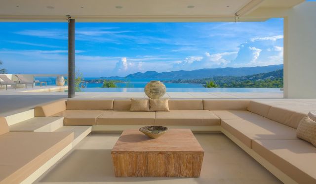 Modern beach house interior design in a Phuket villa with warm minimalist coastal styling.