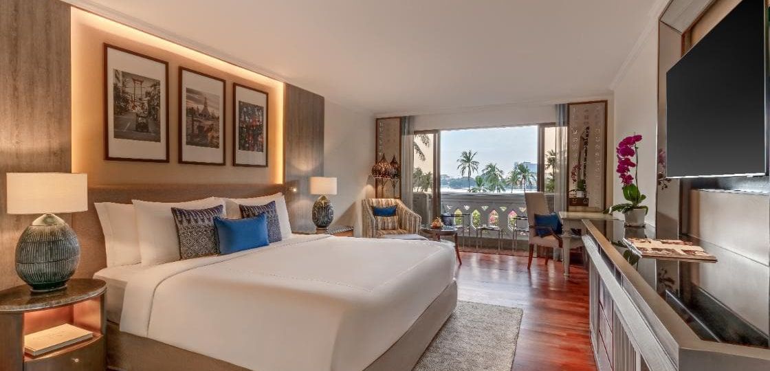 Luxury boutique hotel room interior design with natural textures and ambient lighting