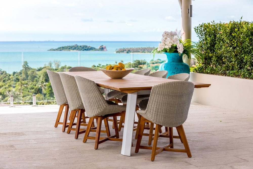 Powder-coated aluminium and teak outdoor furniture on a luxury Koh Samui villa terrace